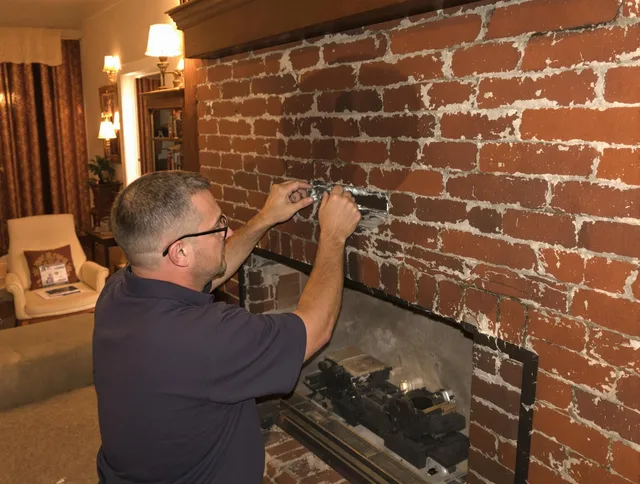 Newport Beach Chimney Sweep expert fixing a fireplace in Newport Beach, CA
